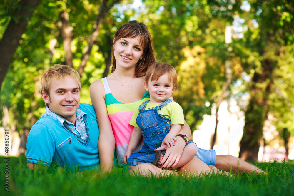 baby with parents in a beautiful summer park baby with parents in a beautiful summer park