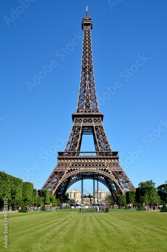 Eiffel Tower under a blue sunny sky in Paris, France