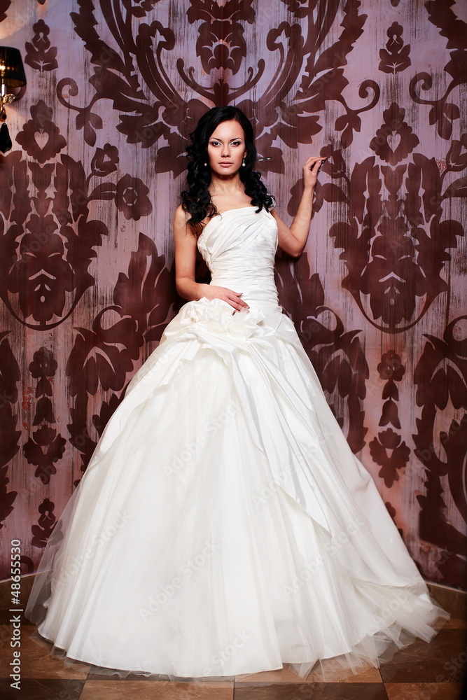 sexy happy bride in white wedding dress in interior sexy happy bride in white wedding dress in interior