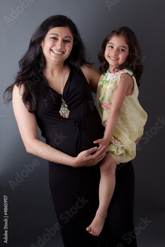 Pregnant East Indian Woman with her Daughter