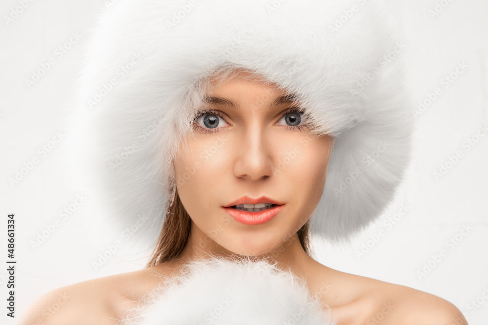 Fashion portrait of young beautiful woman posing on white backgr Fashion portrait of young beautiful woman posing on white backgr