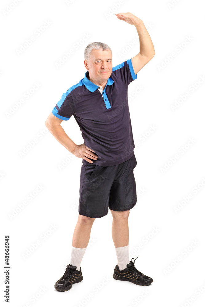 Full length portrait of a middle age man exercising Full length portrait of a middle age man exercising