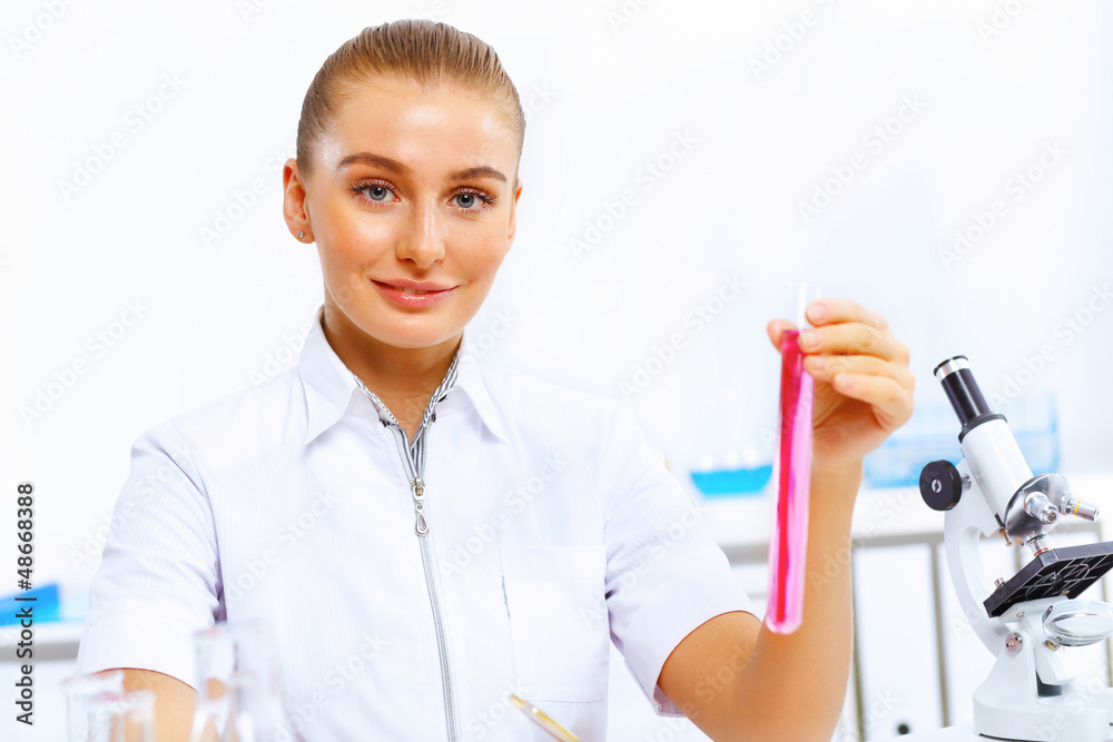 Young female scientist working in laboratory Young female scientist working in laboratory