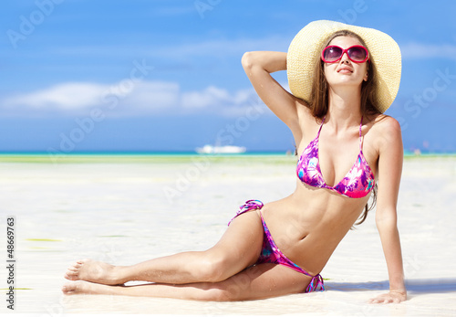 long haired girl in bikini on tropical bali beach