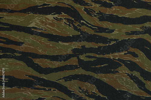 Thai police green tigerstripe camouflage fabric texture backgrou