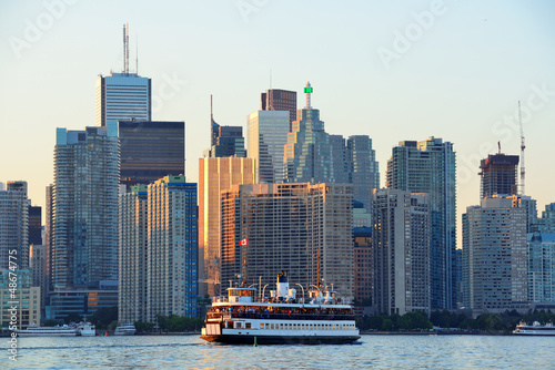 Toronto skyline with boat, urban architecture and blue sky