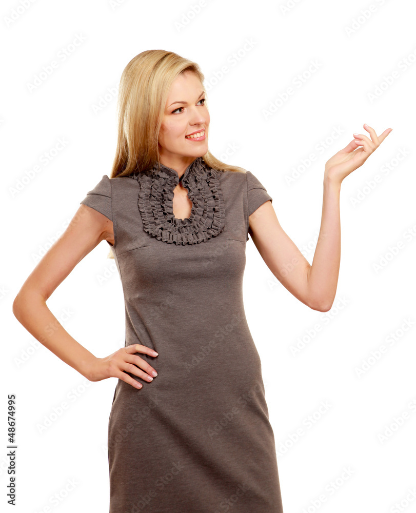 Portrait of a smiling young woman pointing up Portrait of a smiling young woman pointing up
