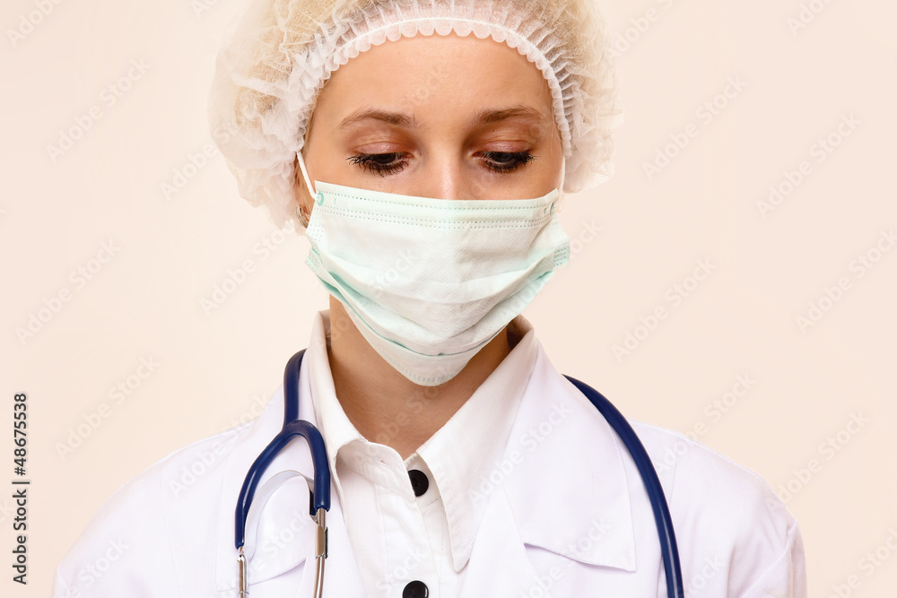 © lenets_tan - Portrait of serious young woman doctor