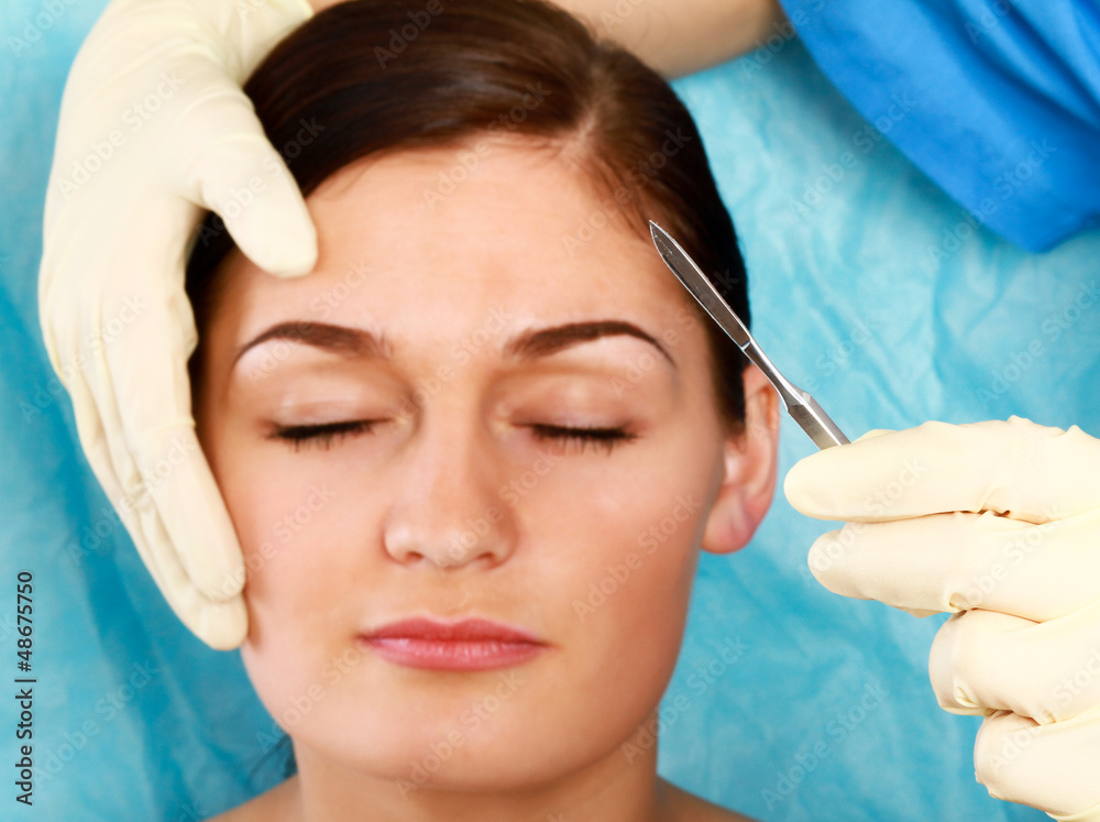A woman receiving a plastic operation, closeup A woman receiving a plastic operation, closeup