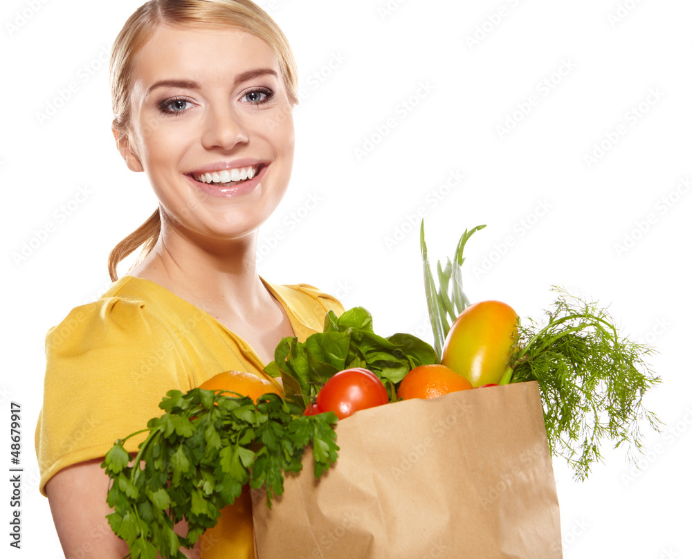 Young woman with a grocery shopping bag. Isolated on white backg Young woman with a grocery shopping bag. Isolated on white backg