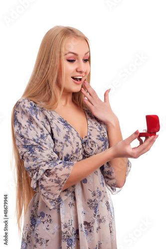Woman looking at engagement ring in a box