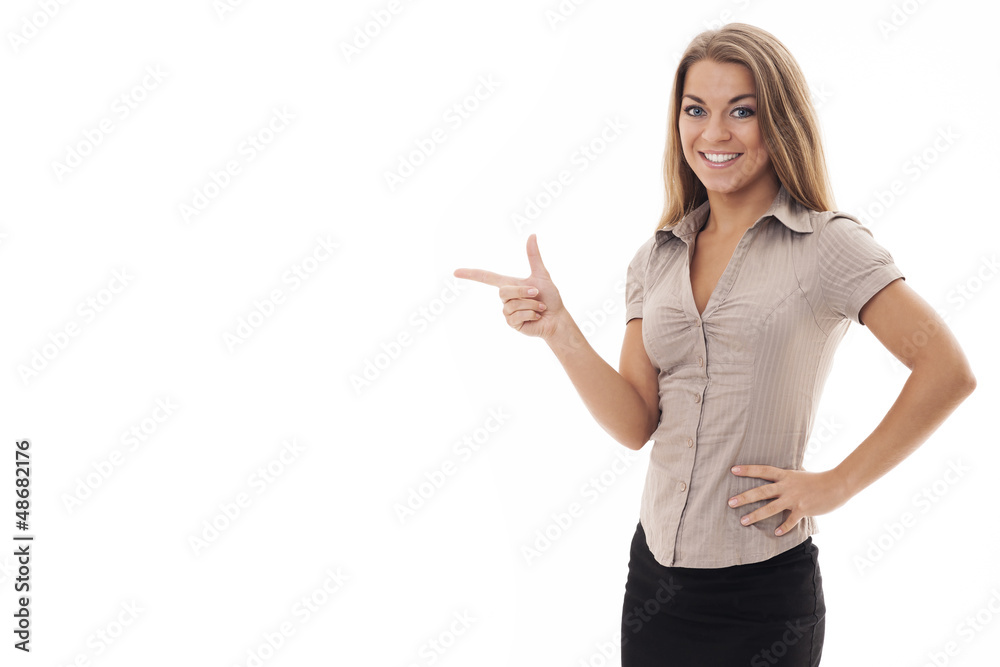 Beautiful businesswoman pointing at copyspace Beautiful businesswoman pointing at copyspace