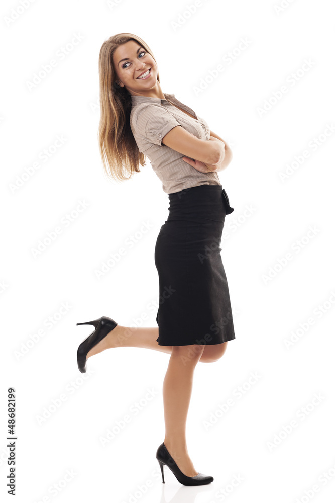 Successful businesswoman kicking up foot Successful businesswoman kicking up foot
