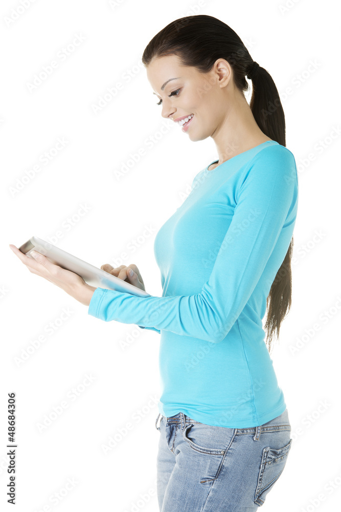 Young pretty woman working on tablet computer Young pretty woman working on tablet computer