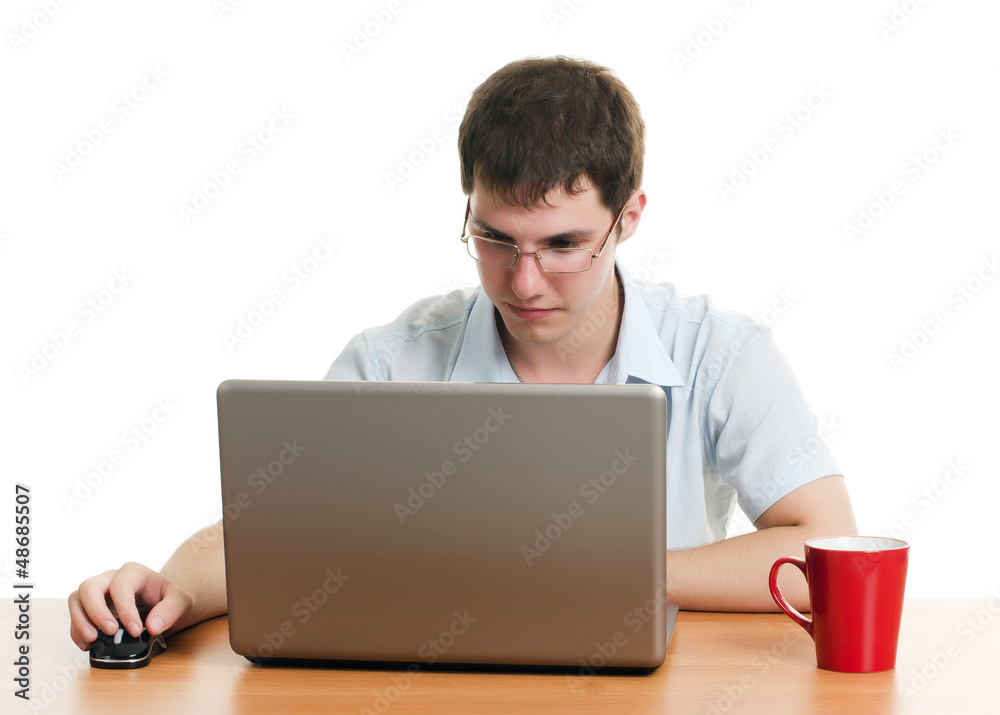 The businessman behind a table with the computer