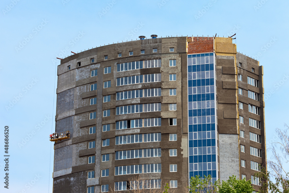 Fototapeta premium Construction of modern building against blue sky