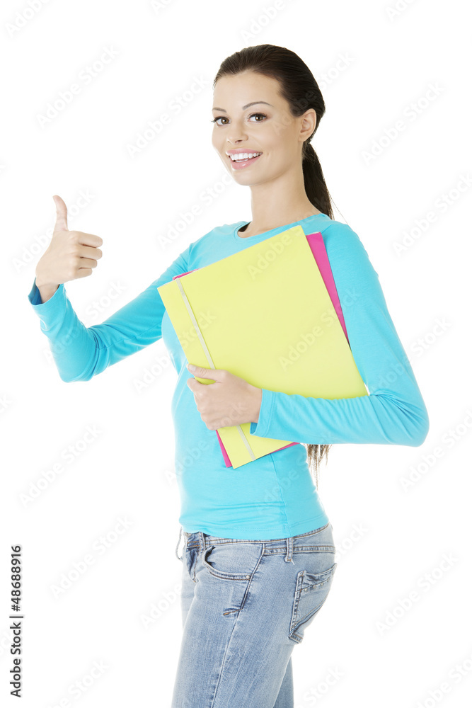 Young student woman gesturing OK Young student woman gesturing OK
