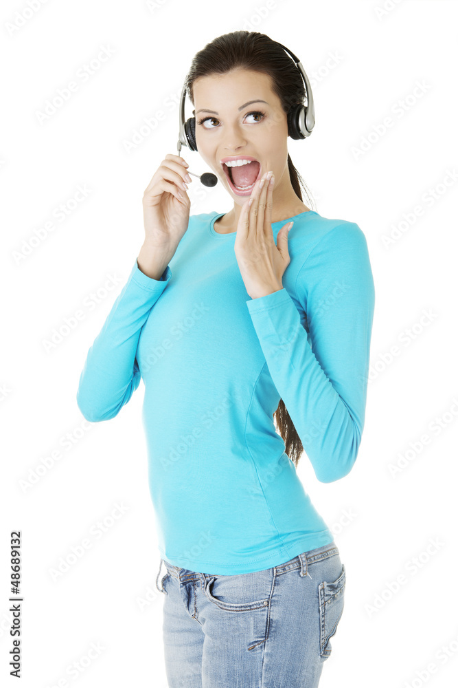 Beautiful young call-center assistant smiling Beautiful young call-center assistant smiling