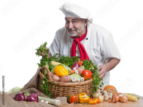 smiling chef wit vegetables