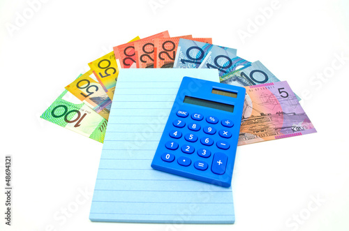 some Australian money with notepad and calculator