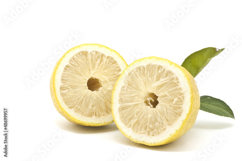 Half Japanese lemon isolated on white background