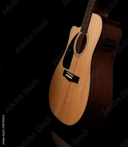 acoustic guitar on a black background