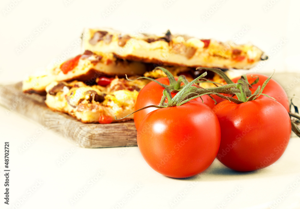 tomatoes with pizza on the background tomatoes with pizza on the background
