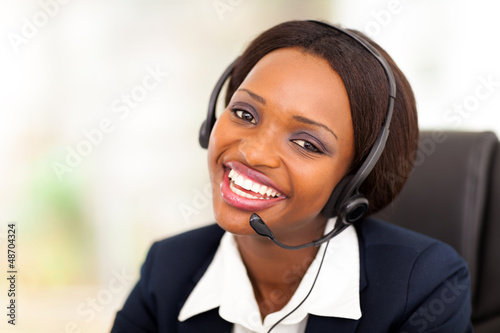 happy african american call center operator with headphones