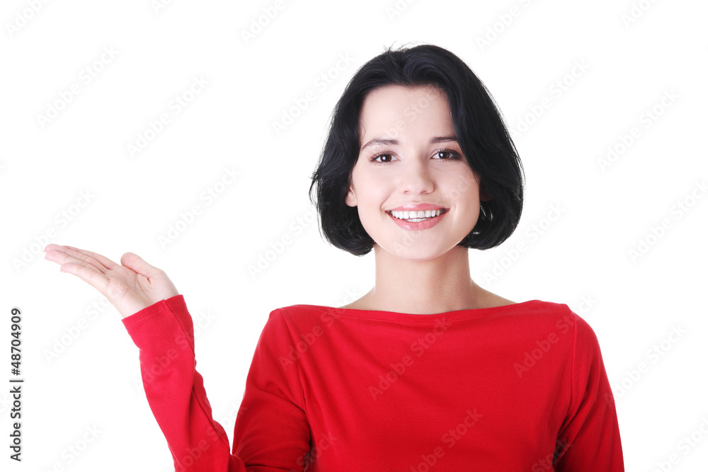 Woman presenting copy space on her palm Woman presenting copy space on her palm