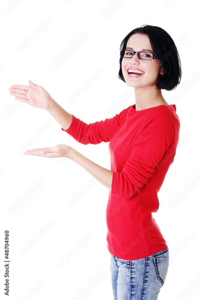 Woman presenting copy space on her palm Woman presenting copy space on her palm