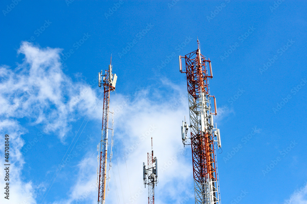 Modern cell and antenna with flat parabola on blue sky