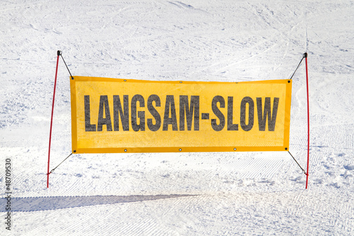 Speed warning sign on slope photo