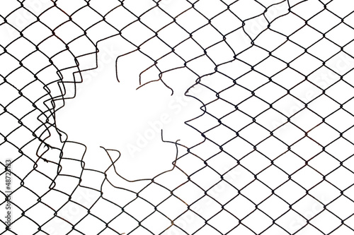 Leinwand Poster hole in the mesh wire fence