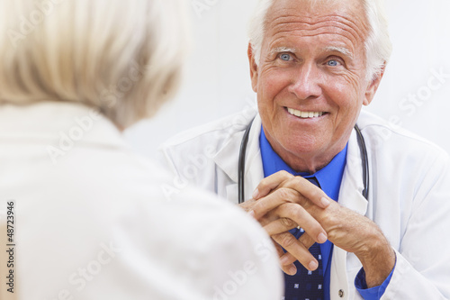 Senior Male Doctor With Elderly Female Patient