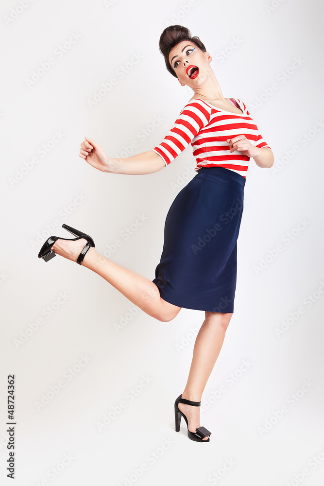 cute jumping woman in t-shirt and skirt