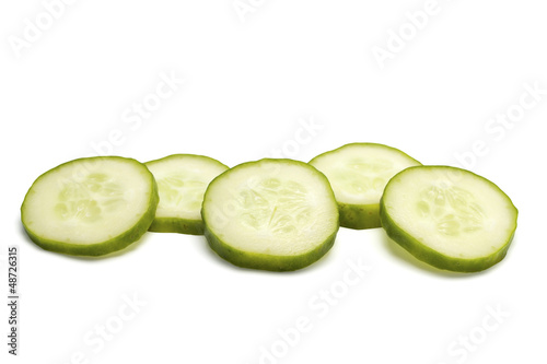 The cucumber cut by circles on a white background