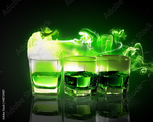 Three glasses of green absinth
