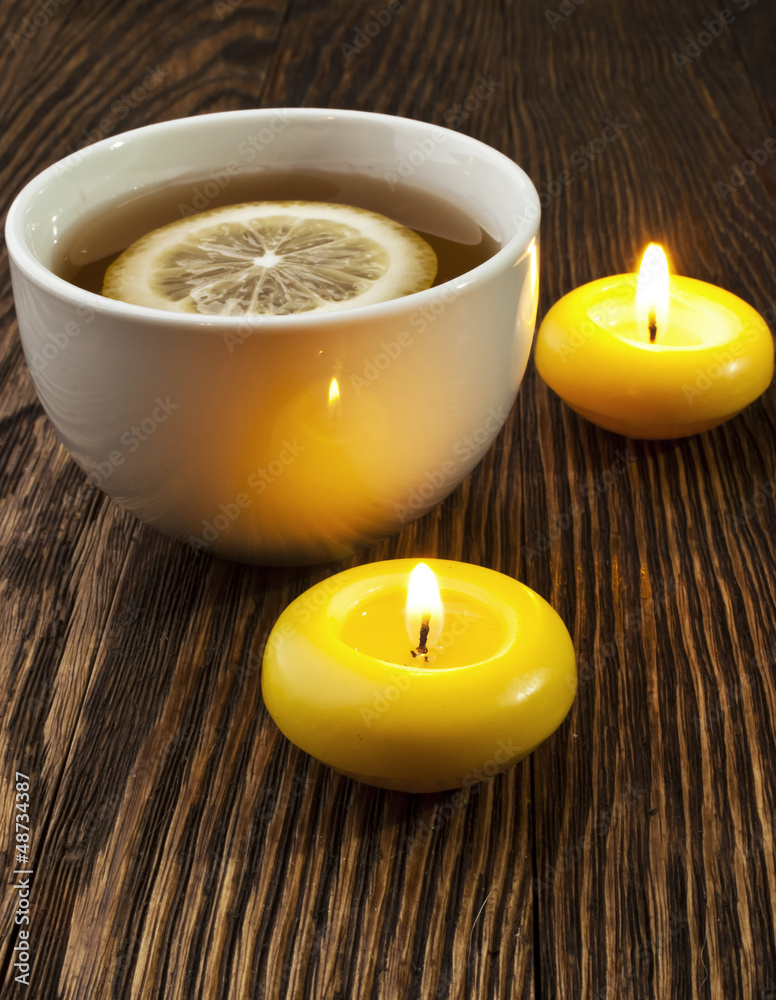 hot tea with lemon and candle hot tea with lemon and candle