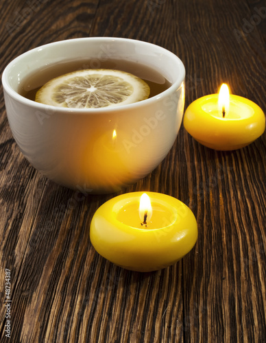 hot tea with lemon and candle
