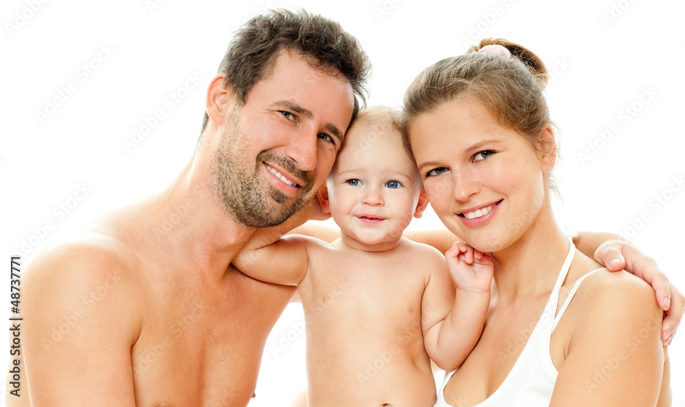 Happy young family with baby. Indoors. Happy young family with baby. Indoors.