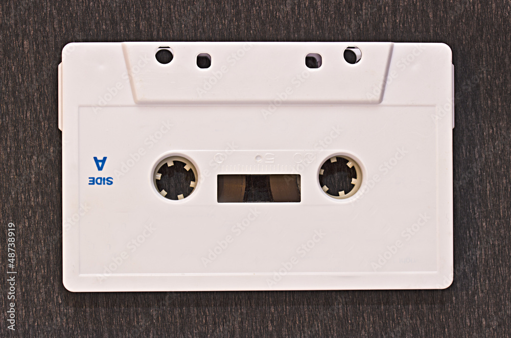 Obraz premium White audiocassette on a dark background
