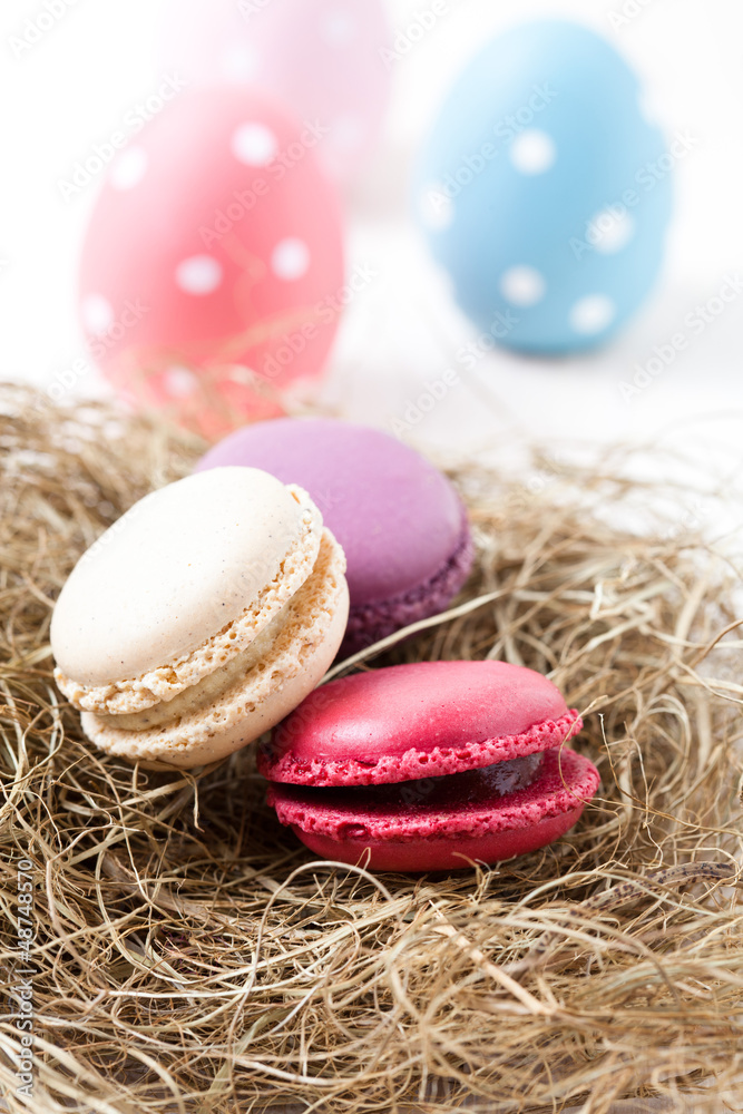 Colorful macaroons and Easter eggs Colorful macaroons and Easter eggs