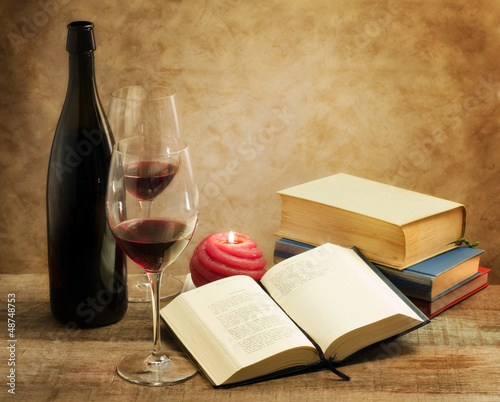 relaxing moments with novel books and pair of wine glass