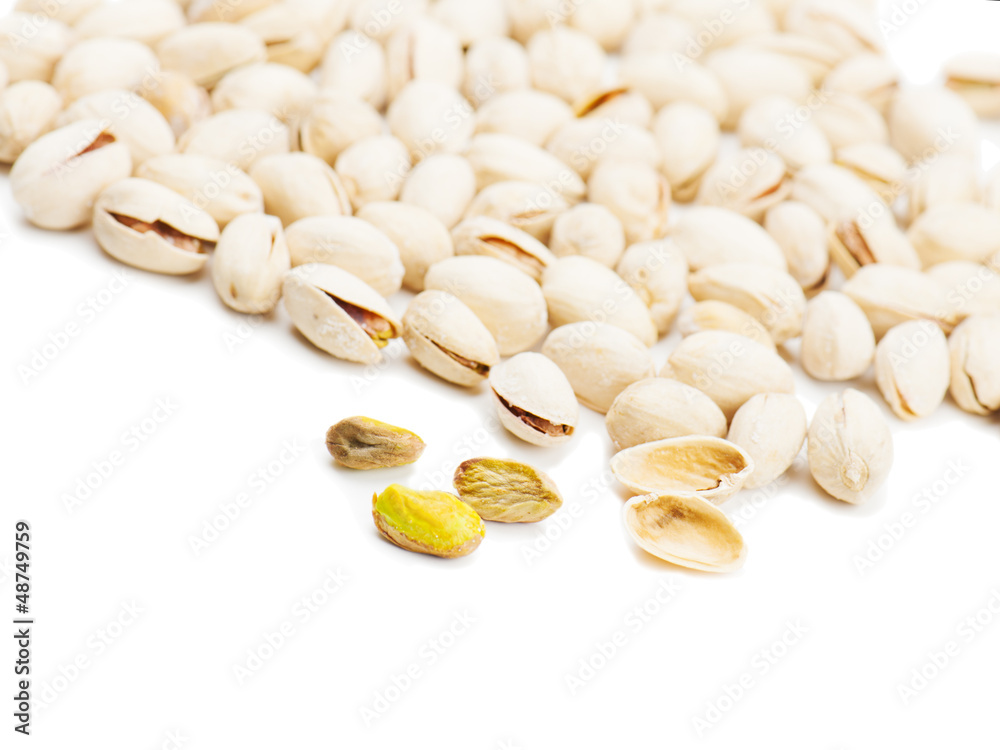 dry salted pistachios on white background dry salted pistachios on white background