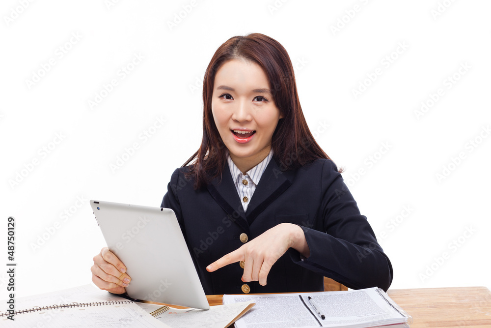 Young Asian student girl using tablet PC Young Asian student girl using tablet PC