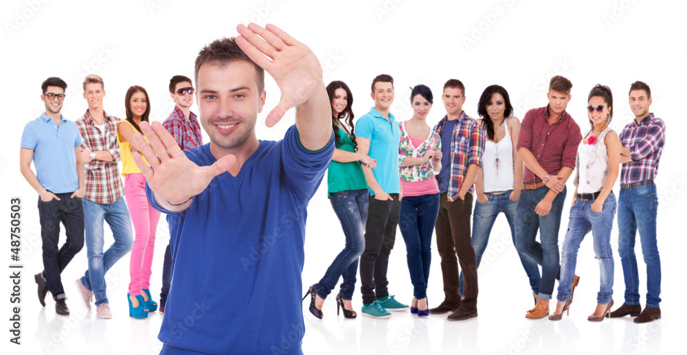 Fototapeta premium man making a hand frame in front of his team