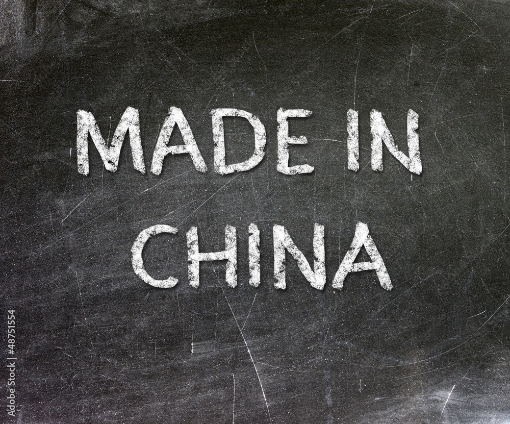 Obraz premium Made in China handwritten with white chalk on a blackboard.