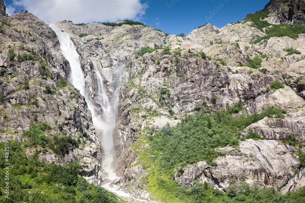 Waterfall high in Caucasus mountains in Georgia