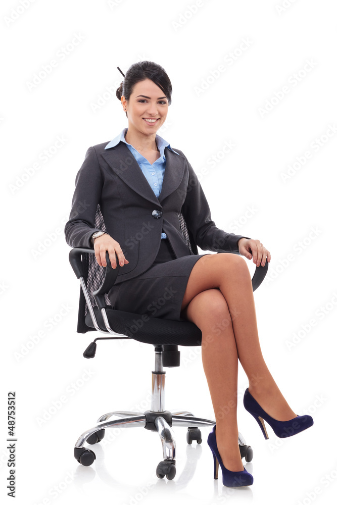 brunette businesswoman sitting in a chair brunette businesswoman sitting in a chair