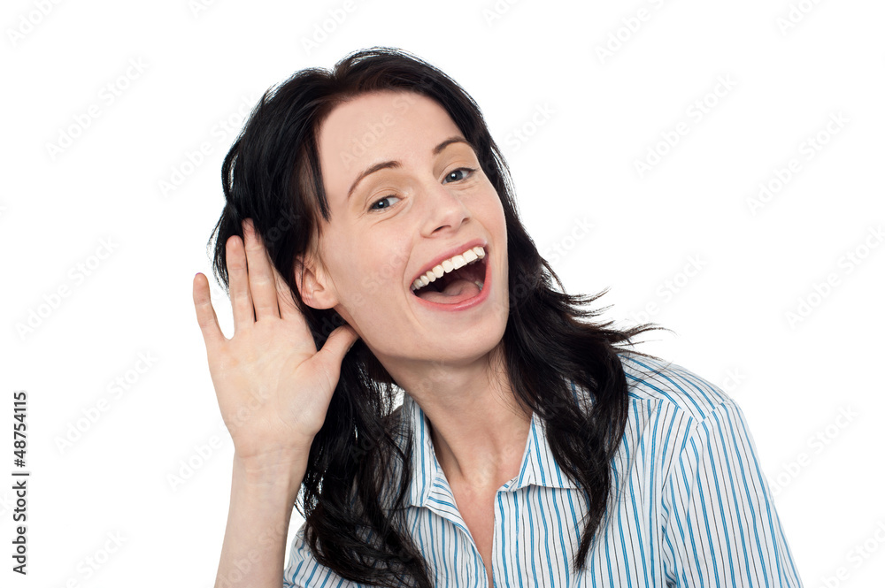Smiling pretty woman eavesdropping Smiling pretty woman eavesdropping
